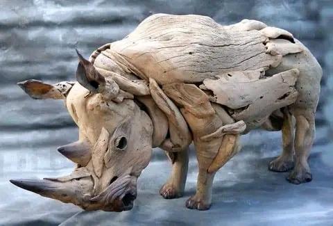Artist Tommy Frediksson creates a well-behaved Rhino sculpture from driftwood.