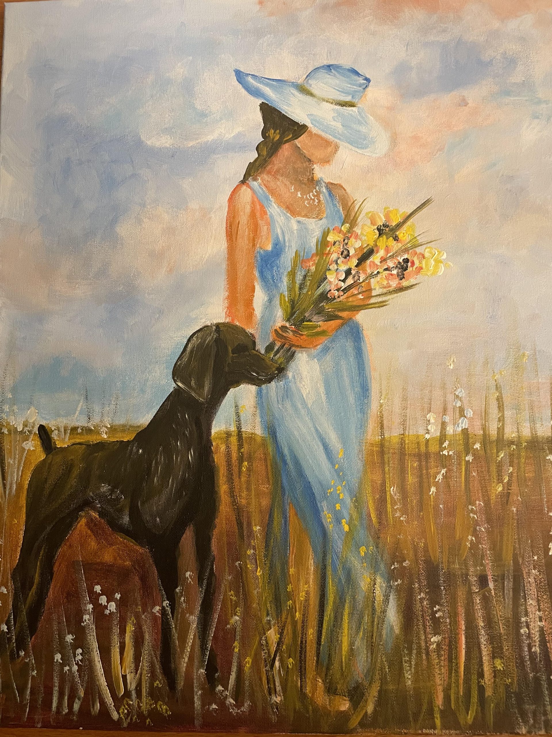Young lady with dog and wild flowers