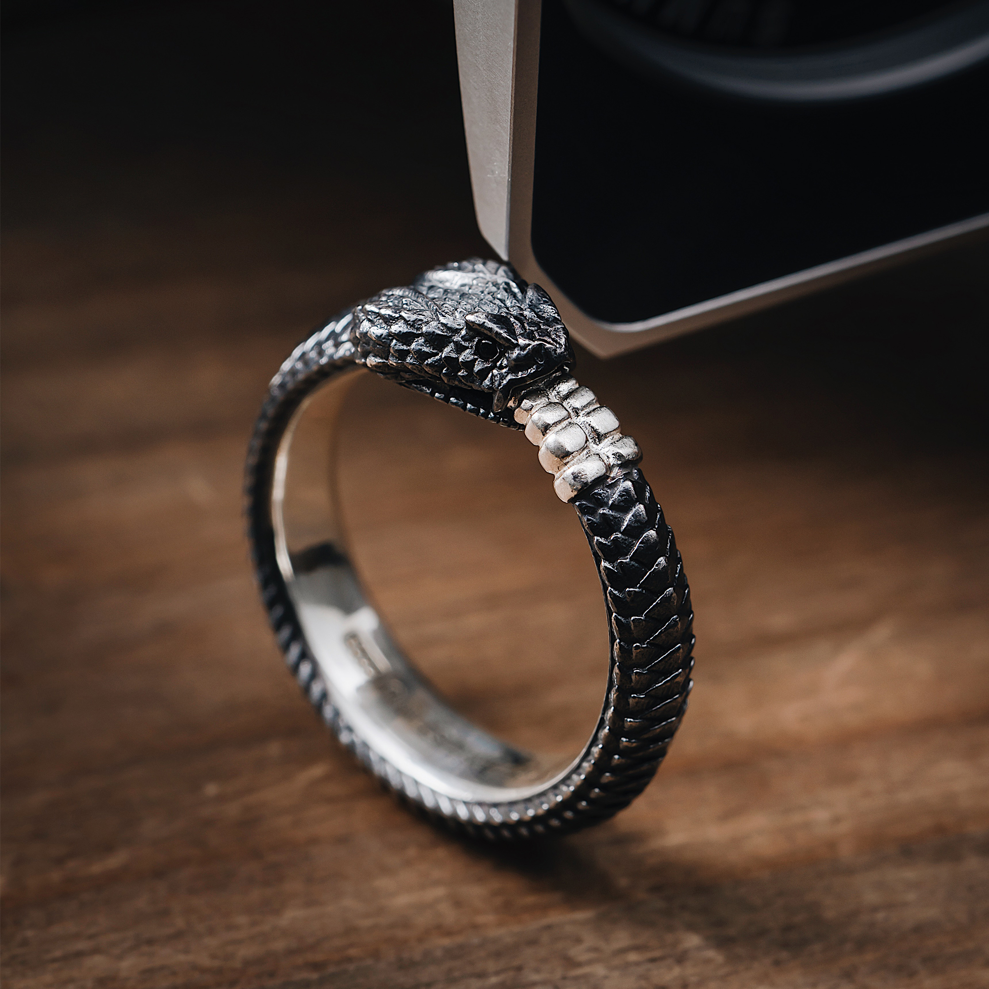 I designed a silver ouroboros ring
