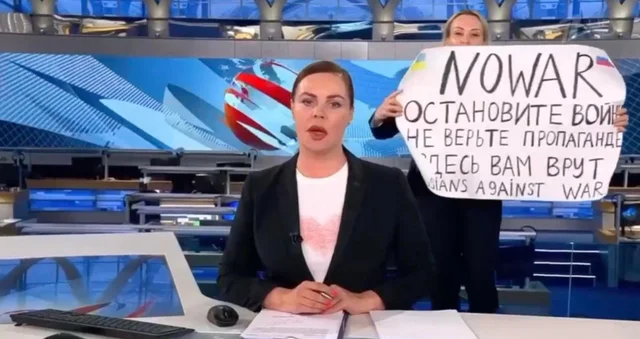 A girl preserve a poster towards Putin invasion in Ukraine for the length of the Russian TV Are residing. Fight for freedom, Stand with Ukrainian.