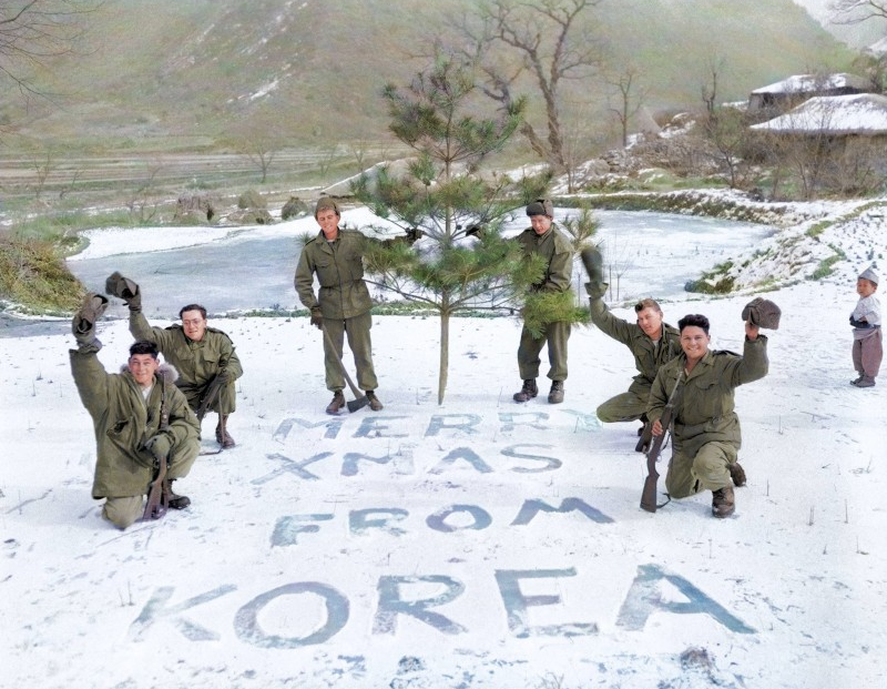 UN troopers enjoing Christmas in the direction of the Korean Battle, colorized