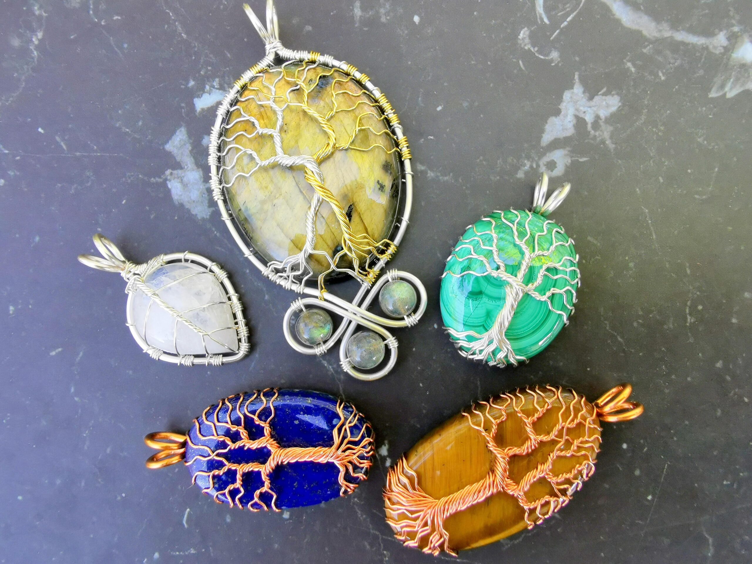 I made some elven pendants with wire and diversified gem stones.