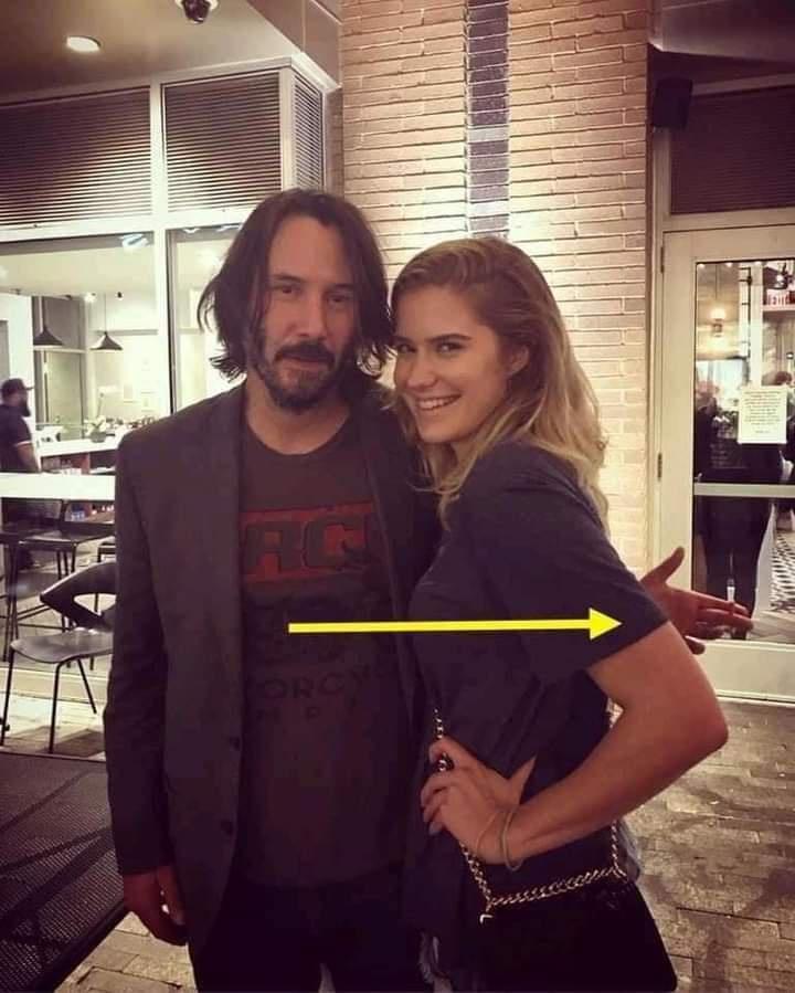 Keanu would now not touch any lady whereas taking photographs with her