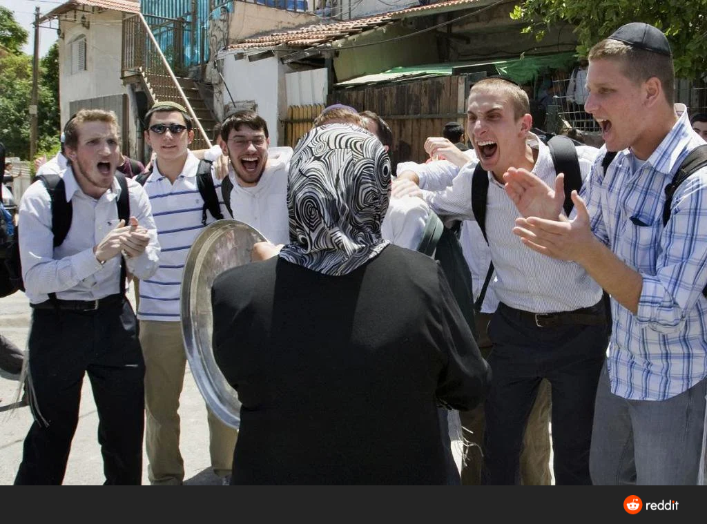 Israeli settlers making fun of a Palestinian girl evicted from her home in Sheikh Jarrah
