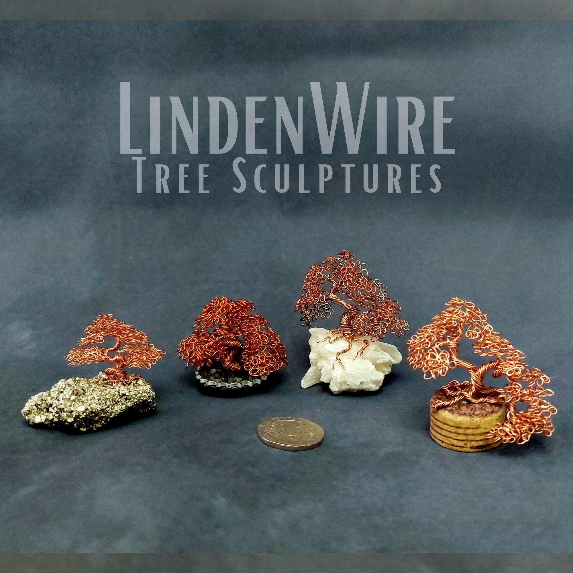 4 exiguous bonsai tree sculptures