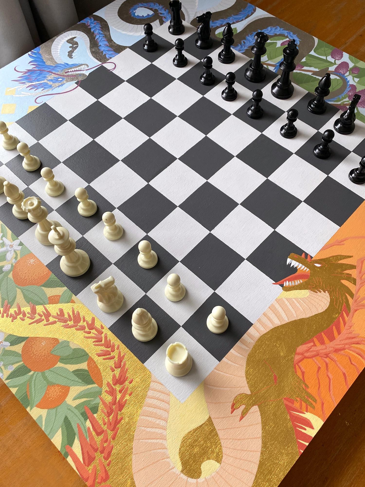 I painted a dragon-themed chessboard.